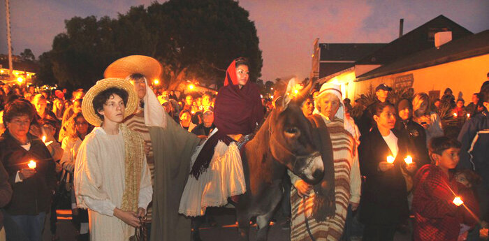 Participants of a previous Las Posadas event re-enact the search by Mary and Joseph for lodging in Bethlehem.