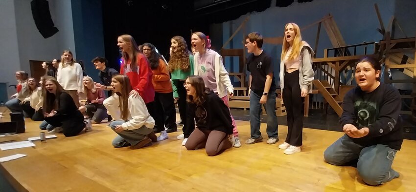 Cast members perform a song from &ldquo;Les Mis&eacute;rables&rdquo; during a recent rehearsal in the auditorium at Ponte Vedra High School.