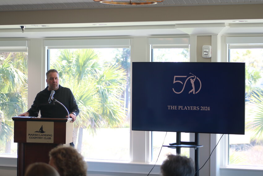 THE PLAYERS executive director Lee Smith speaks next to the tournament&rsquo;s 50th anniversary logo during the St. Johns County Chamber of Commerce Ponte Vedra Beach Division luncheon on Feb. 14.