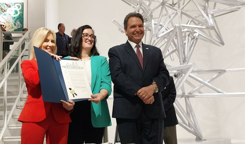 Jacksonville Mayor Donna Deegan, left, holds up her proclamation during the recent event at MOCA. Standing next to Deegan are the museum&rsquo;s Executive Director Caitl&iacute;n Doherty and University of North Florida President Moez Limayem.