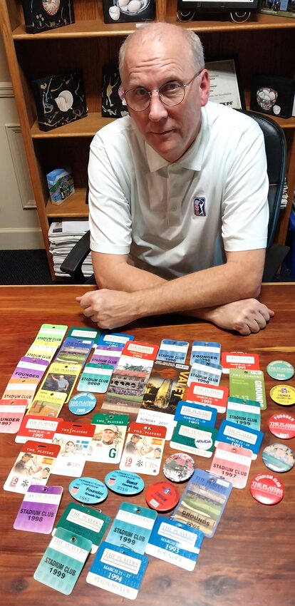 PGA Tour historian Laury Livsey is seen with numerous vintage PLAYERS Championship badges, some dating back to the 1970s.