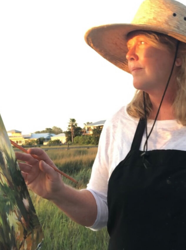 Martha Ferguson at work on a painting.