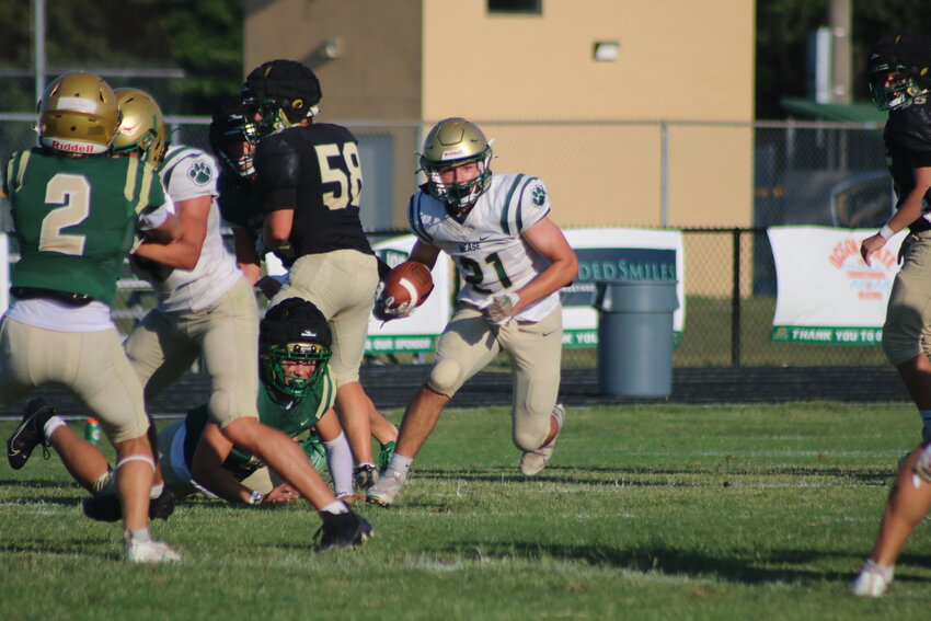 Rising junior Enrique Ordonez (No. 21) looks to break free during the Nease Green and Gold game on May 16.