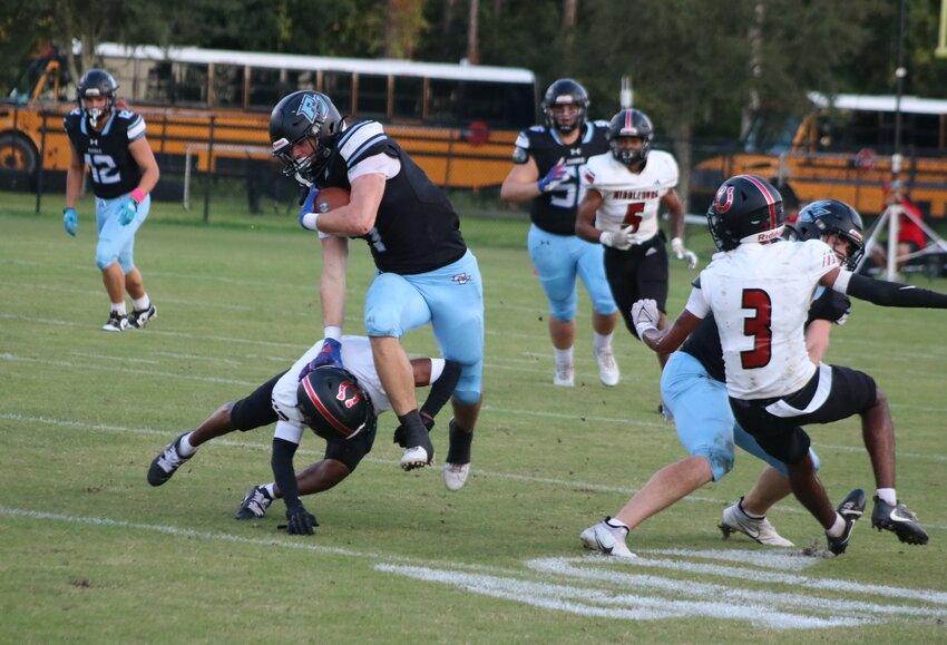 Brian Case stiff-arms a Middleburg defender before breaking free for a 72-yard touchdown run.