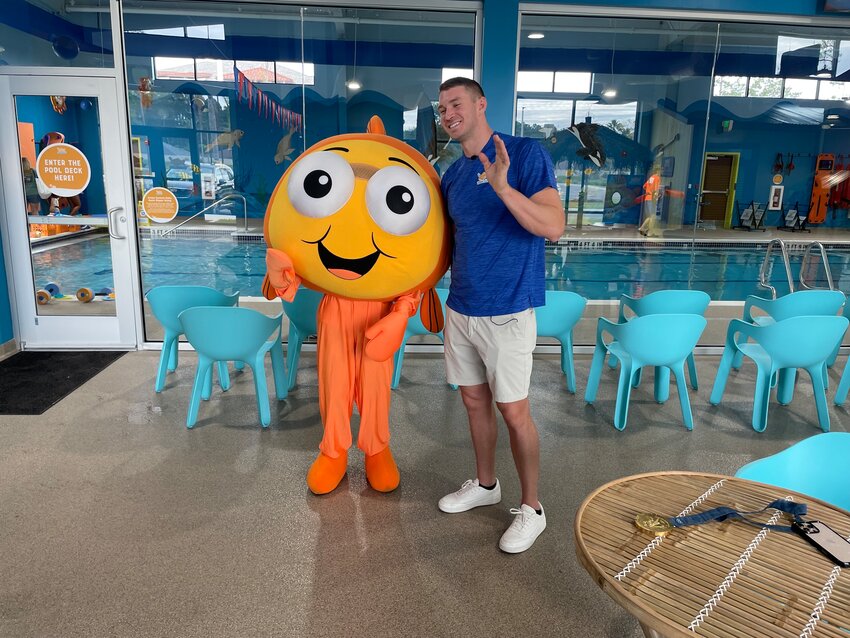 Ryan Murphy with mascot Bubbles