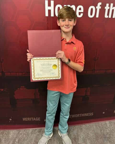 Crawford accepting his award at the St. Johns County MLK Essay Contest ceremony.