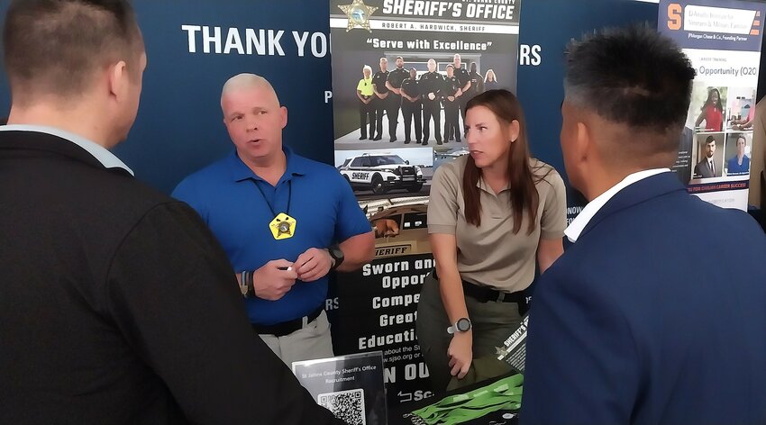 Representatives of the St. Johns County Sheriff&rsquo;s Office speak with job seekers during THE PLAYERS&rsquo; annual Military Job Fair.