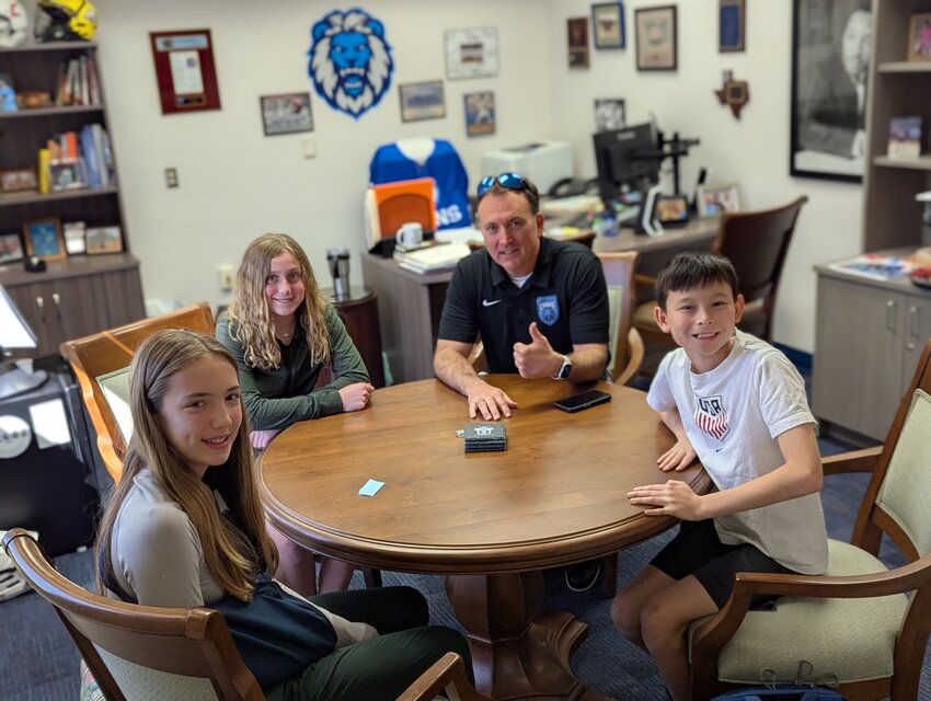 Principal Troy Kasting shares a special lunch with February&rsquo;s &ldquo;Students of the Month,&rdquo; honoring their hard work and dedication.