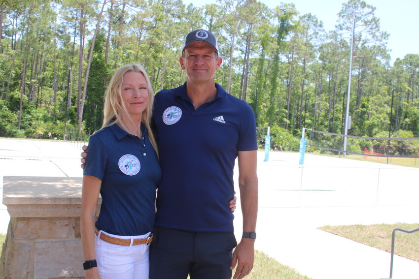 Vanessa Summers-Gyulai and Andor Gyulai stand in front of the new beach volleyball courts which are set to open in the Nocatee community on June 1.