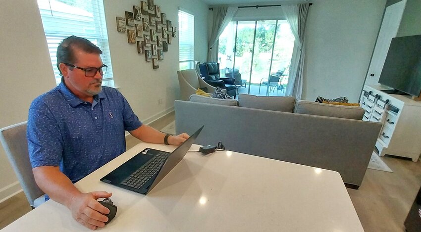 Robert Sershon looks up the RRPF website in his home near St. Augustine.
