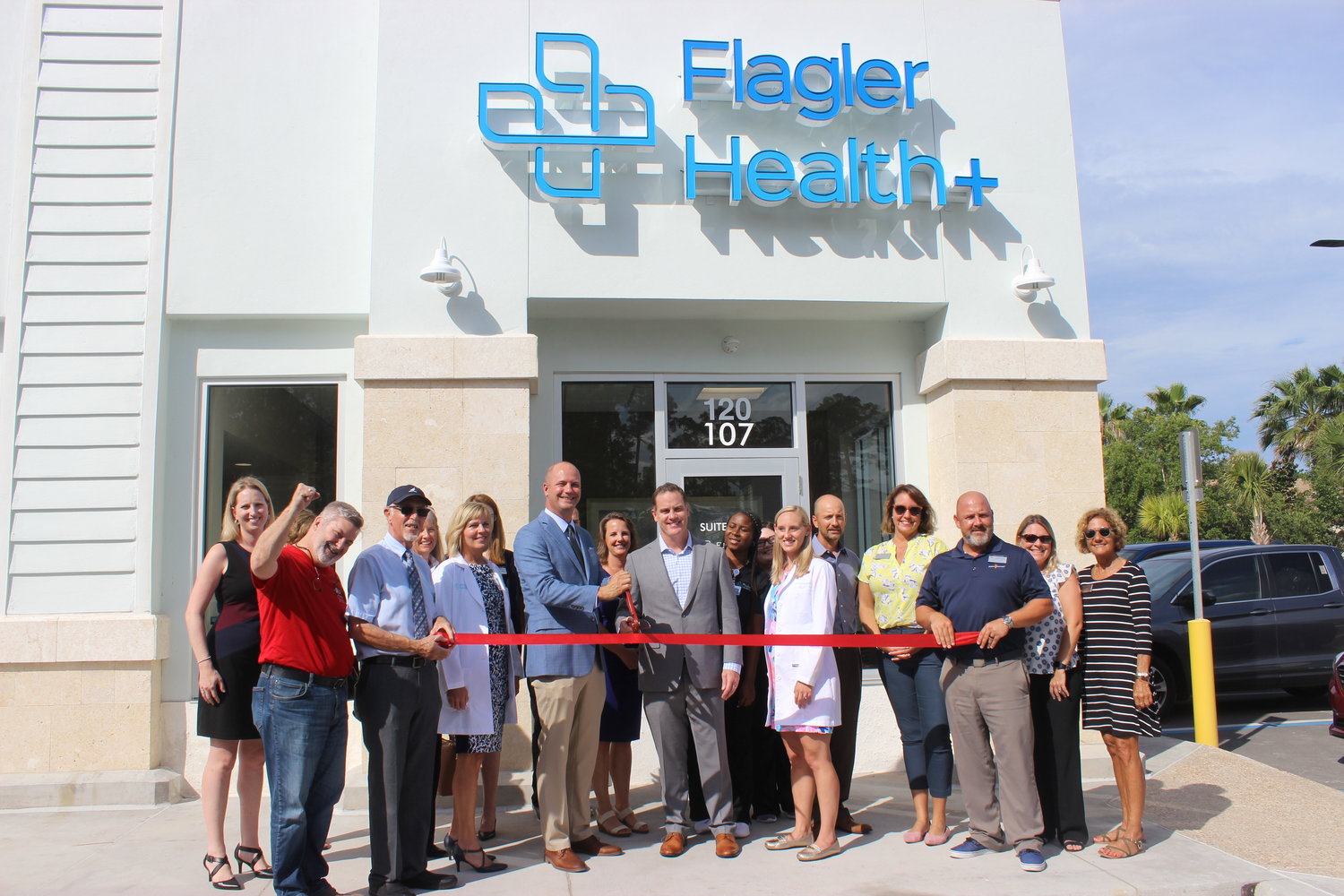 Representatives from Flagler Health+ celebrate the opening of its new primary care and pediatrics office in Palencia with a ribbon-cutting ceremony on June 10.