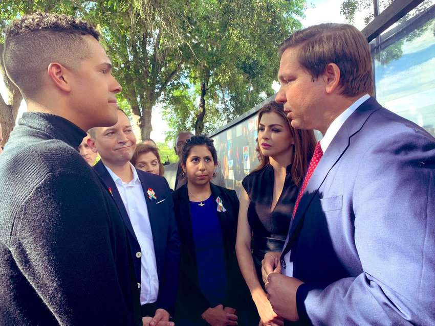 Brandon Wolf (left) meets with Governor Ron DeSantis at the site of the Pulse nightclub shooting in 2021.