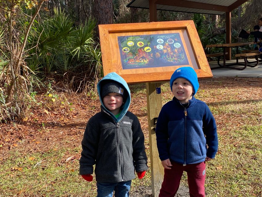 Cash and Kaden, both three years old, were enthusiastic about being some of the first to tour StoryWalk in Linear Park.