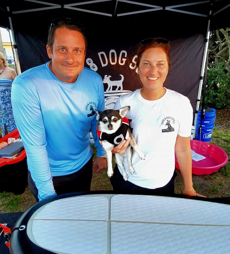 City Commissioner Eric Cooley, Mayor Suzie Johnston and surf dog Wednesday in 2023.