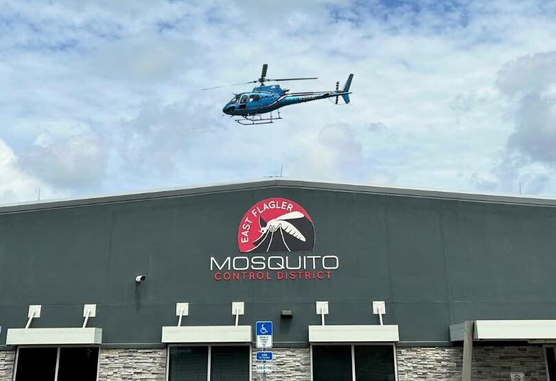 The new Airbus H-125 above the Mosquito Control headquarters.