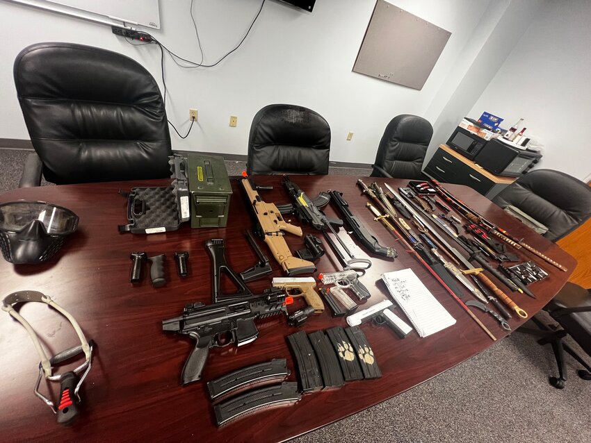 The weapons and list said to have been found in the boy's possession.