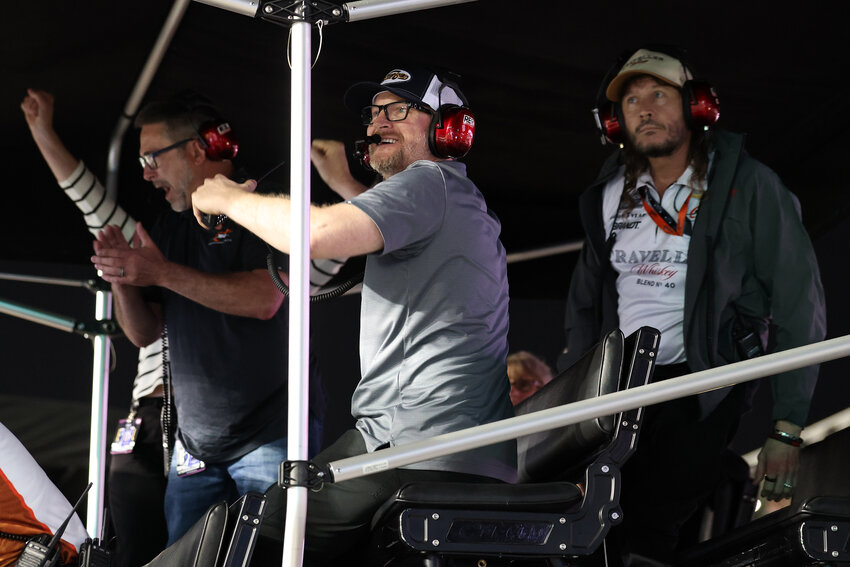 An emotional Dale Earnhardt Jr. (center) celebrates making the Daytona 500 as a team owner for the first time. | Chris Graythen/Getty Images