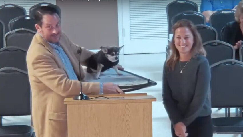 Eric Cooley and Suzie Johnston with Wednesday the chihuahua at the February 27th City Commission meeting.