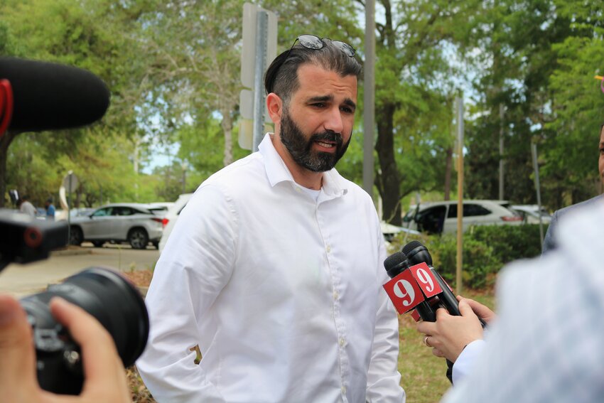 Josh Weil speaks to reporters on election day in Palm Coast.