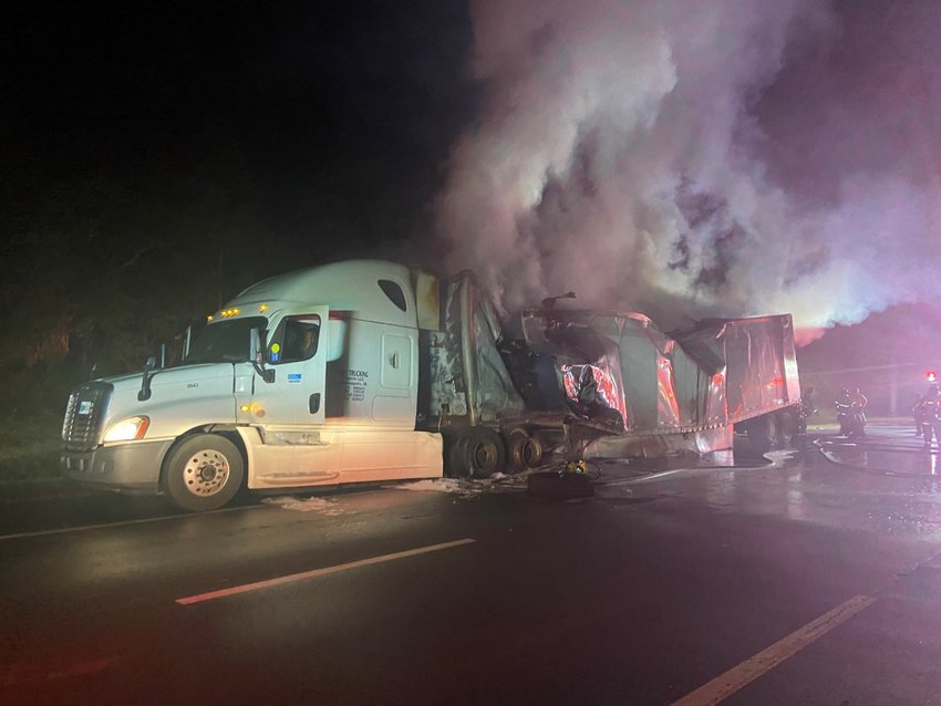 The truck as it burns on the side of I-95
