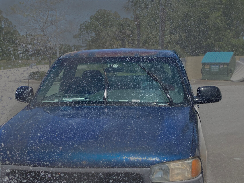 Motorist Steven Reilly drives through precipitation near his place of work.