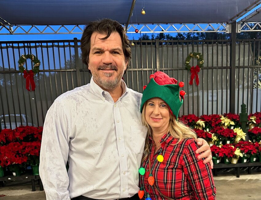 Michael Chiumento III of Chiumento Law and Teresa Rizzo of hte Flagler Education Foundation at a Christmas charity event in December.