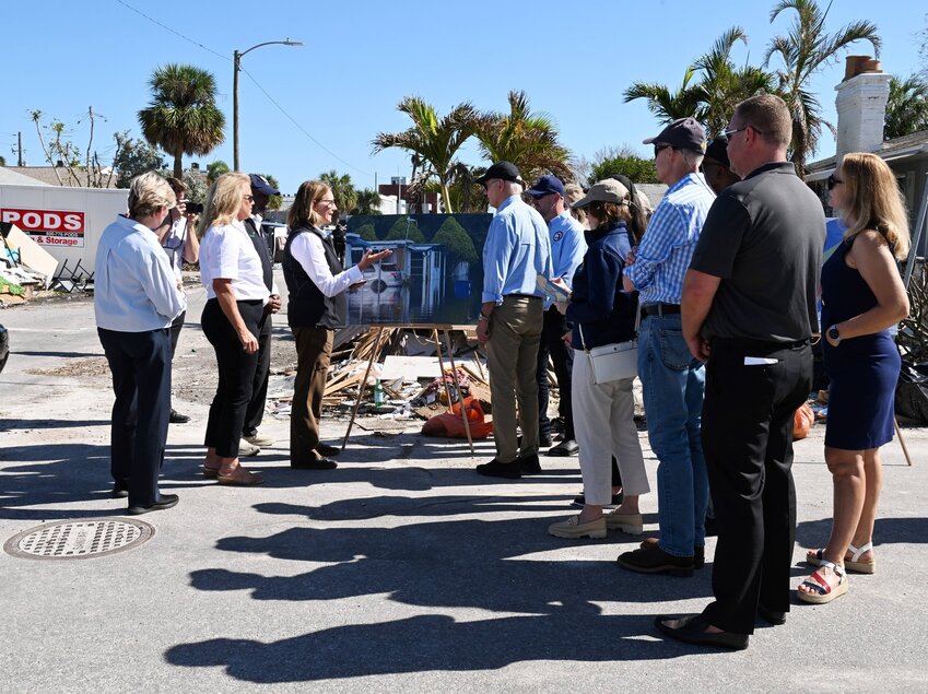 President Joe Biden (center right) surveys hurricane damage in St. Petersburg, Florida.