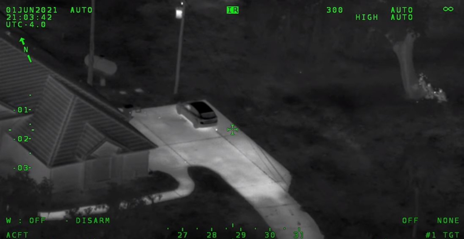 Footage from Air One just after 14-year-old Nicole Jackson opened fire on Volusia County deputies with a shotgun. Deputies can be taking cover in the top right corner of the photo by a tree. Jackson can not be seen from this angle.