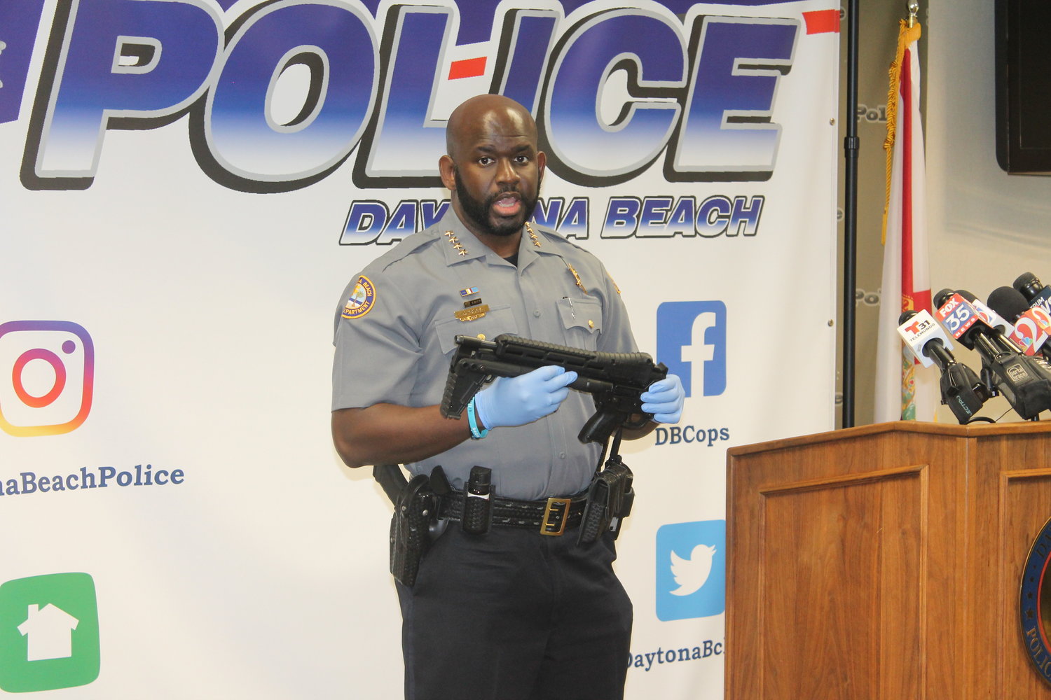 Chief Young holding the rifle Hagins intended to use in the plot
