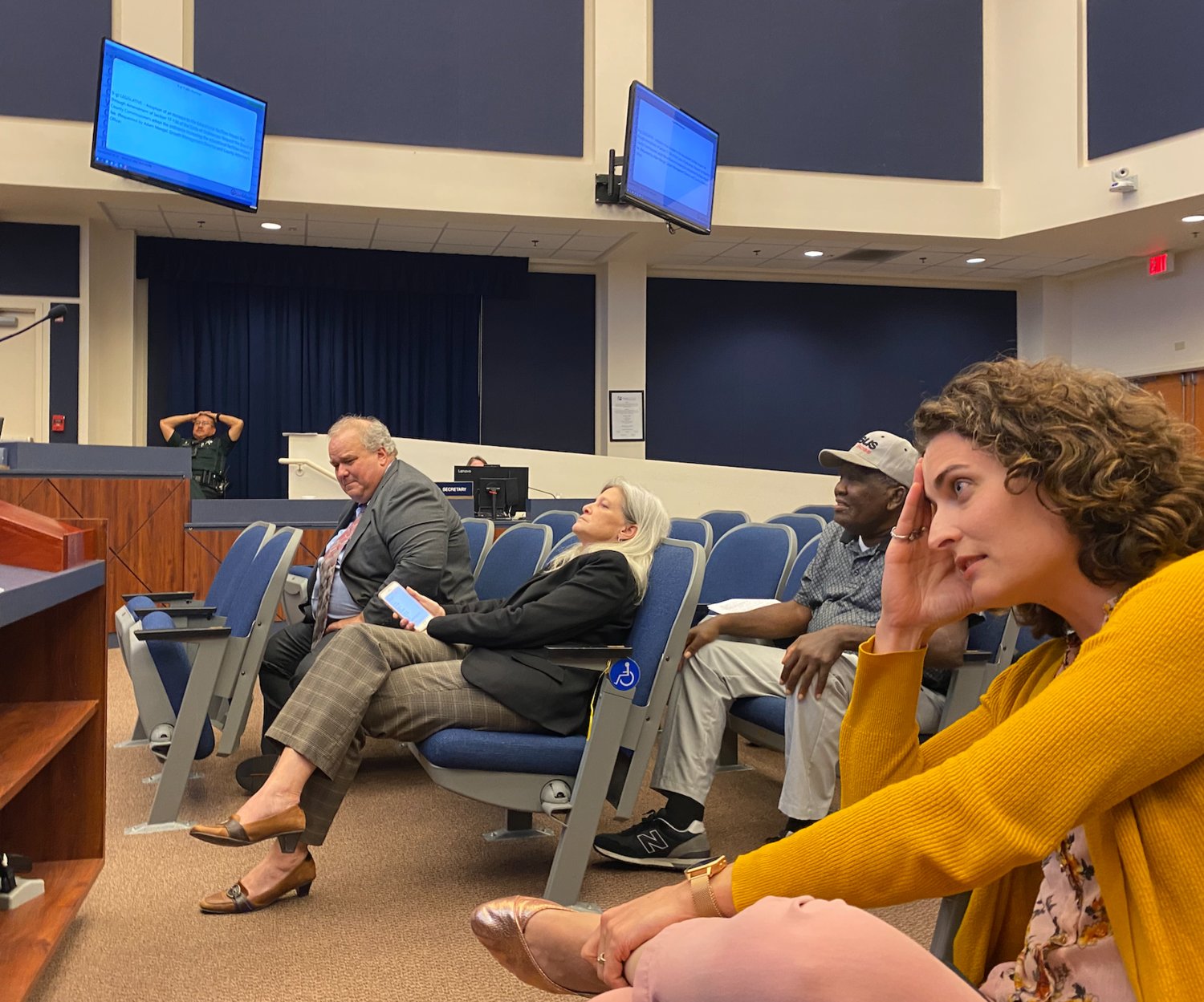 The meeting didn’t end until after 11:00 pm. L-R: Growth Management Director Adam Mengel, School Board Attorney Kristy Gavin, Palm Coast City Council candidate Sims Jones, and School Board candidate Courtney VandeBunte.