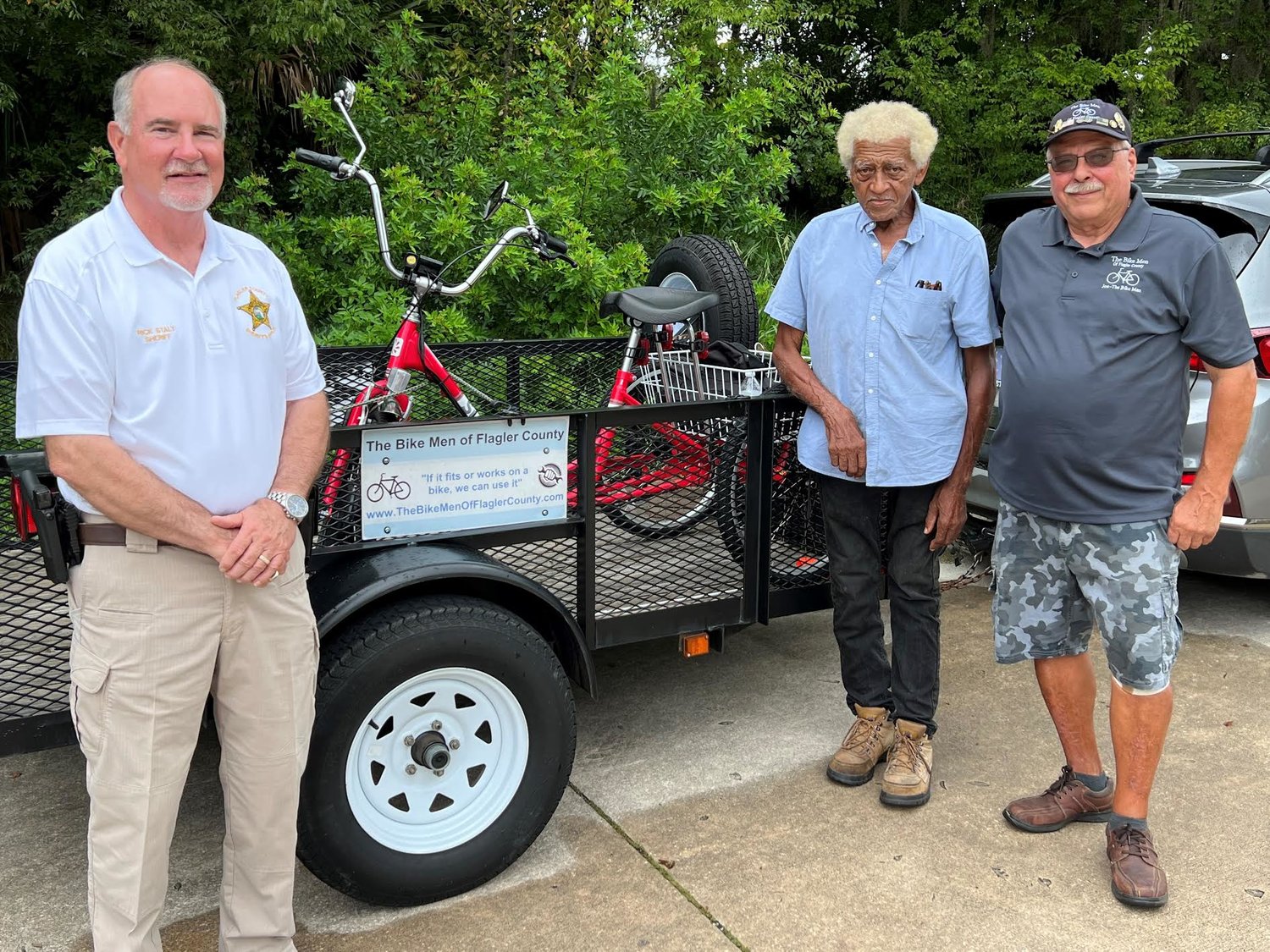 Sheriff Rick Staly, Francisco Diaz, and Joe Golan of the Bike Men of Flagler County.