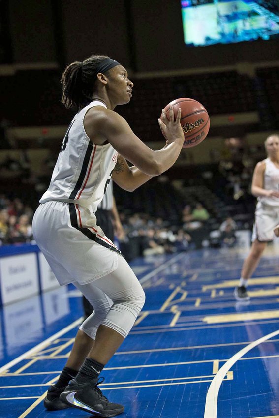 UCM's Nija Collier squares up a shot.