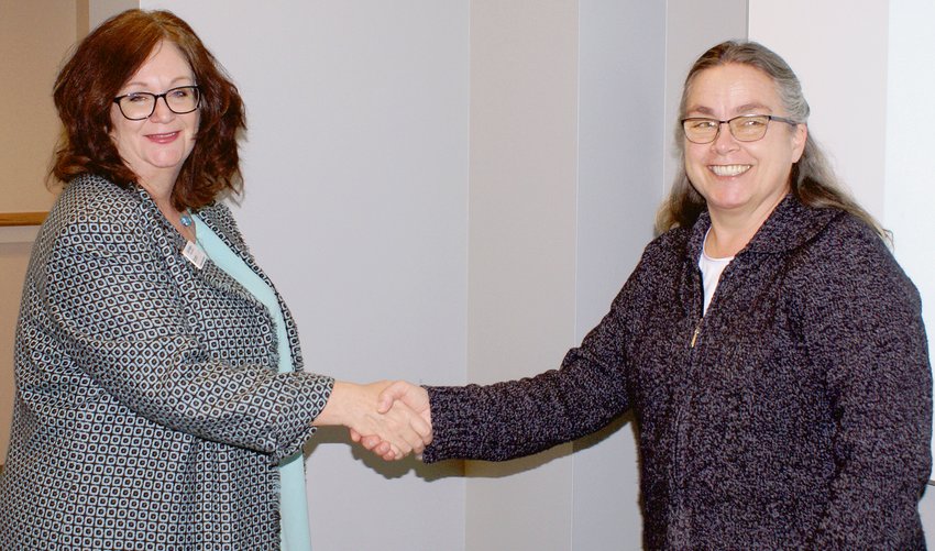 Julie Rodgers is sworn in to the OATS Transit Board of Directors by OATS Transit Vice President Krissy Sinor.