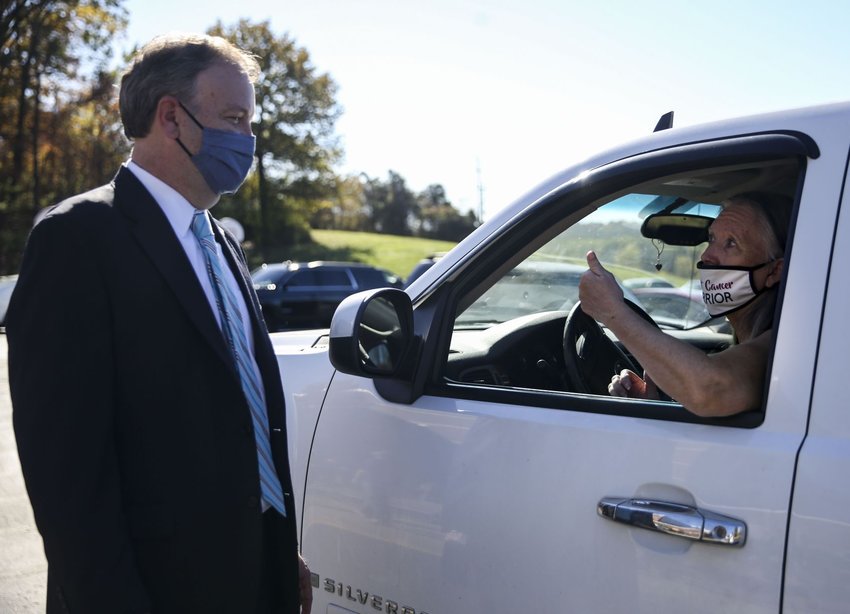 Sheri Elpers, right, gives County Executive Sam Page a thumbs up outside the Rogers Elementary School polling location in Oakville on Tuesday, Nov. 3, 2020. Elpers, a breast cancer survivor, says Page saved her life as her doctor two years ago while she was fighting the cancer. &quot;I'm a Republican, but I voted for him,&quot; says Elpers adding that she thinks he is doing the best he can dealing with the Coronavirus pandemic. Photo by Colter Peterson, cpeterson@post-dispatch.com