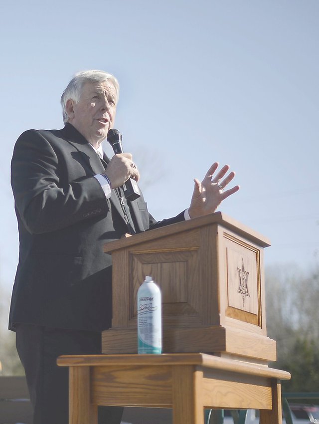 Gov. Mike Parson speaks to a crowd of state and Boone, Cole and Callaway counties officials Monday at the trailhead of the Katy Trail just outside of Jefferson City. Parson helped dedicate a monument for the bicentennial celebration of Boone, Cole and Callaway counties.