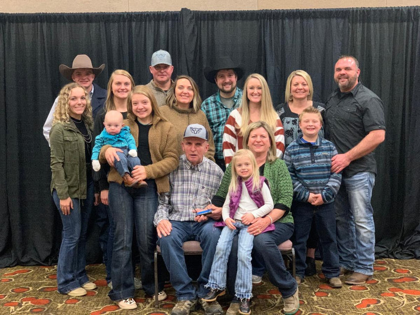 Rick Anstine, of Kingsville, poses for a photo alongside his family members after he was recognized with the Missouri Cattlemen's Association &quot;Pioneer Award&quot; at its 53rd Annual Missouri Cattle Industry Convention and Trade Show on Jan. 9.