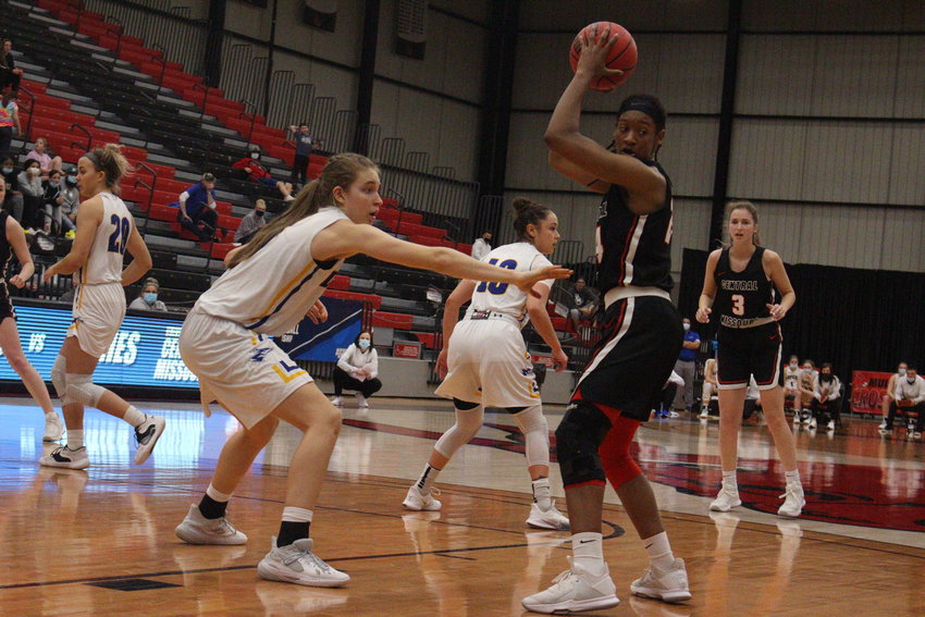 Central Missouri senior Nija Collier seeks an open teammate while facing pressure from Nebraska-Kearney during the NCAA Division II Central Region Championship on Monday, March 15 at the UCM Multipurpose Building.