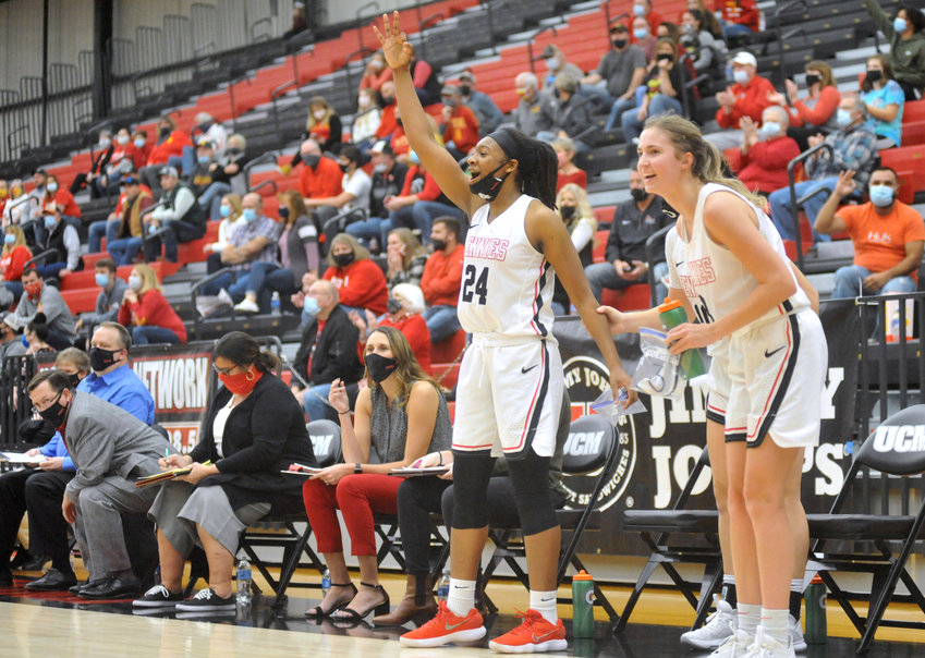 Central Missouri senior Nija Collier celebrates a 3-pointer from the bench Nov. 28 during a 78-61 victory over Pittsburg State at the Multipurpose Building in Warrensburg.