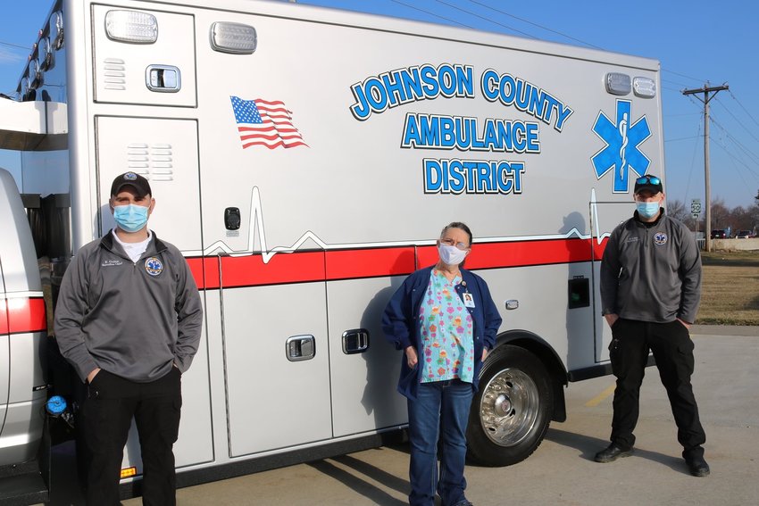 Johnson County Ambulance District paramedic Ben Minks, Johnson County Community Health Services Public Health Coordinator Ronda Davis and JCAD paramedic Kevin Guinm pose for a photo during one of JCAD&rsquo;s homebound patient vaccination trips.