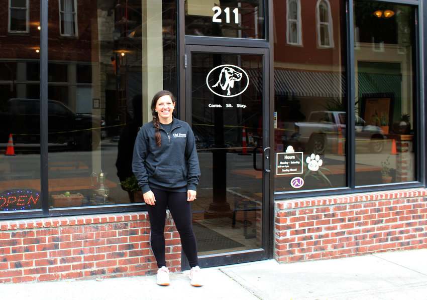 Old Drum Coffeehouse co-owner Jen McCleary stands outside her newly-acquired storefront.