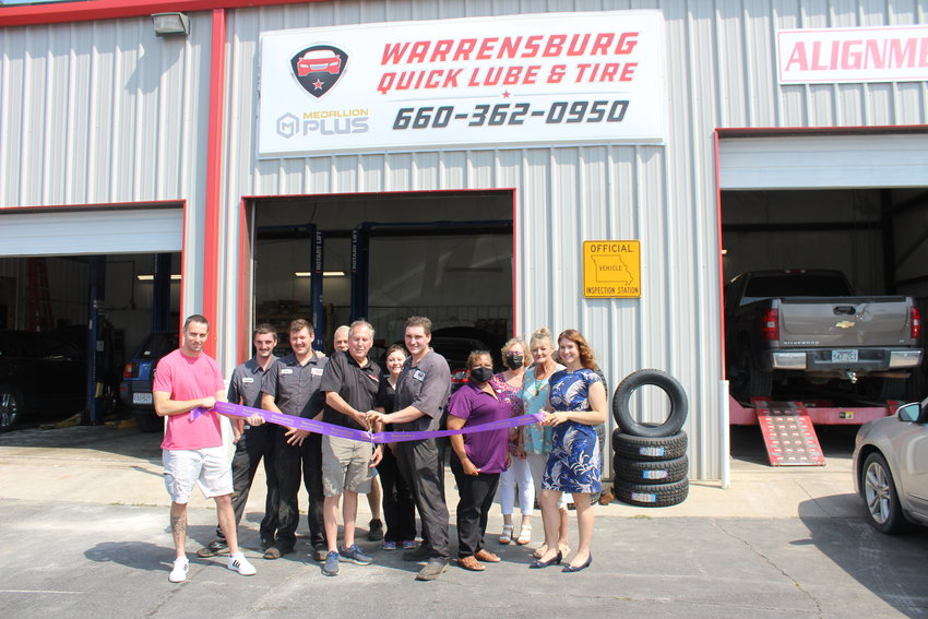 Warrensburg Quick Lube and Tire co-owners Gary Hunt and Aaron Crisp cut the Warrensburg Chamber of Commerce&rsquo;s ceremonial ribbon on Thursday, Aug. 12, to celebrate the business&rsquo; new location at 211 E. Young Ave., Warrensburg.