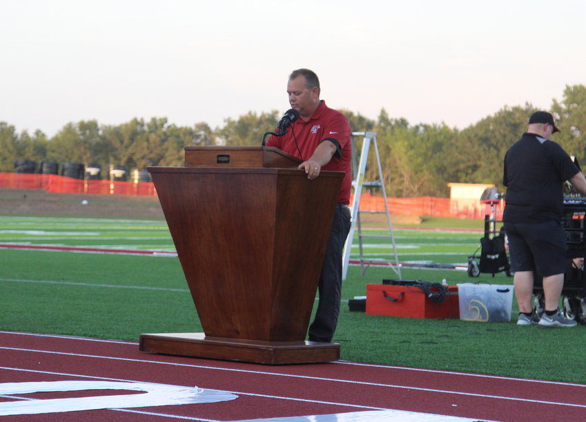 Warrensburg Activities Director Keith Chapman speaks during the decdication of the Warrensburg Activities Complex and Ron Clawson Track on Aug. 26, 2021.