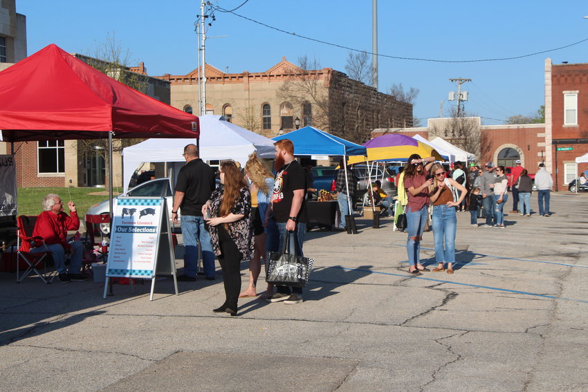 Local residents browse the vendors set up at the Warrensburg Farmers&rsquo; Market during the market&rsquo;s regular 2021 season.