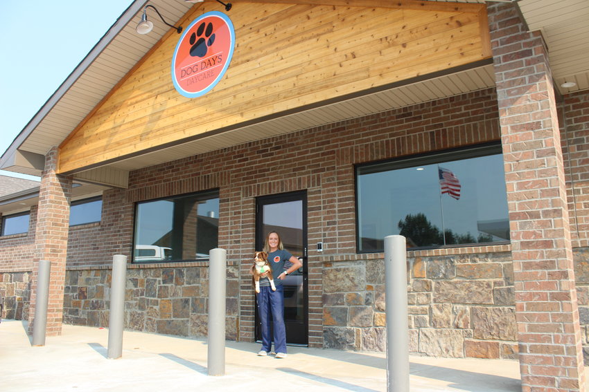 Dog Days Daycare owner Casey Colson poses for a photo outside her new business.