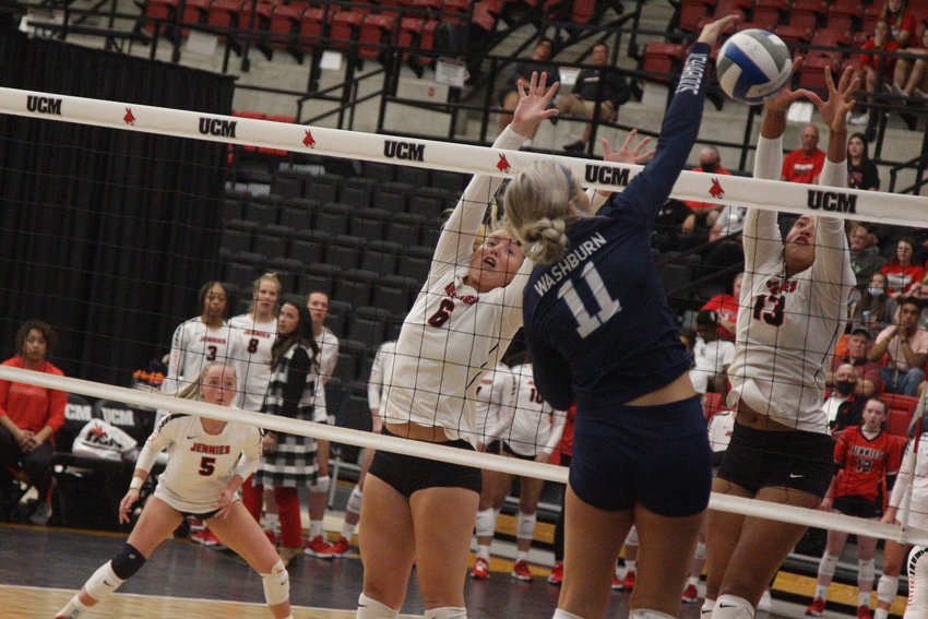 Central Missouri seniors Hannah Engelekn (left) and Aubree Bell attempt to block a shot fro Washburn senior Sydney Fitygibbons on Saturday, Sept. 25, at the Multipurpose Building.