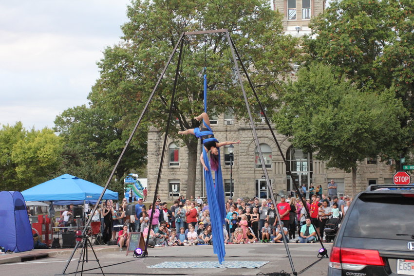 An artist uses aerial silks in a performance during Burg Fest.&nbsp;
