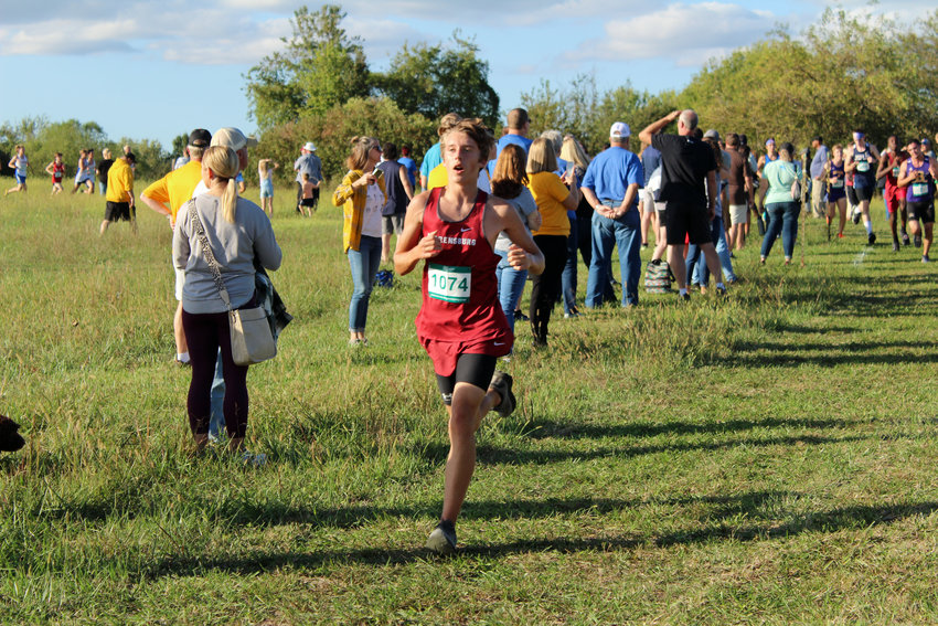 Warrensburg sophomore Julian McNeil runs in the Warrensburg Cross Country Invitataional on Thursday, Oct. 14, at Warrensburg High School.
