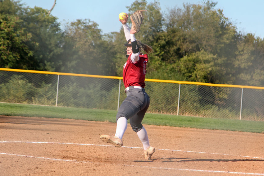 Warrensburg junior Payton Smith winds a pitch against Nevada on Friday, Oct. 15, at Harrisonville High School.