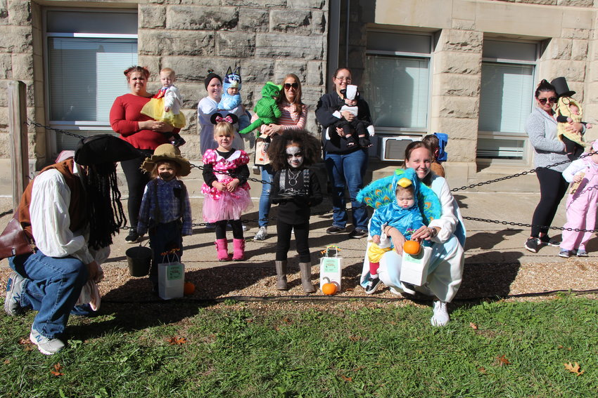 Costume contest winners in the 0-3 age category pose for a picture at the Downtown Spooktacular event Saturday, Oct. 30.