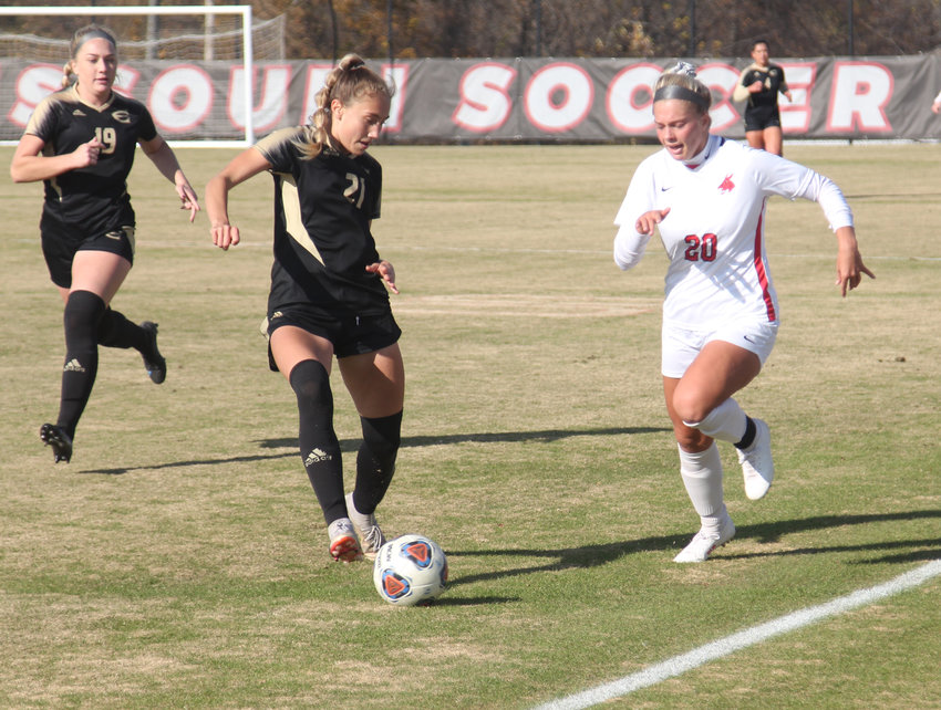 Central Missouri freshman Caroline Cole dribbles the ball up field against Emporia State on Sunday, Nov. 14, at the UCM South Recreation Complex.